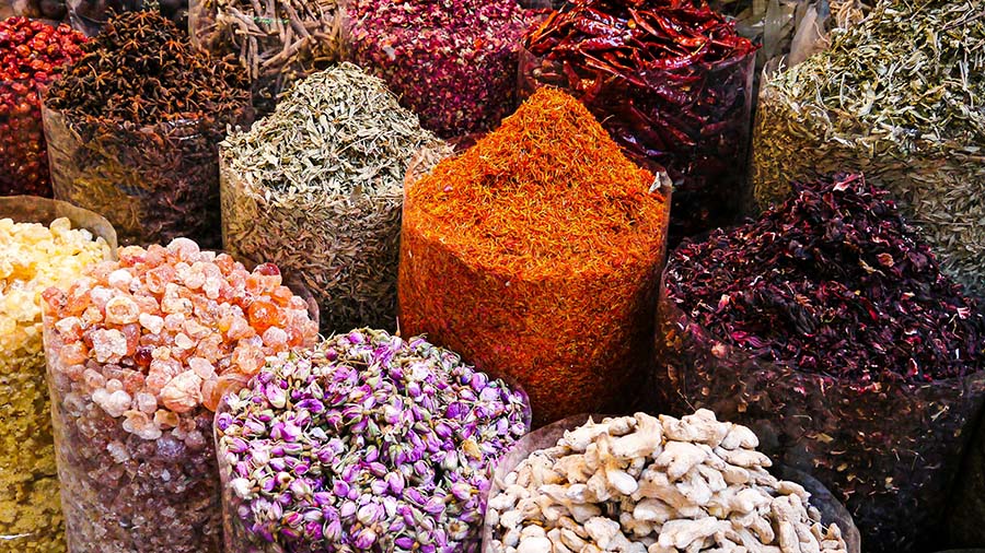 Collection of authentic Iranian spices - Saffron, sumac, turmeric and dried limes